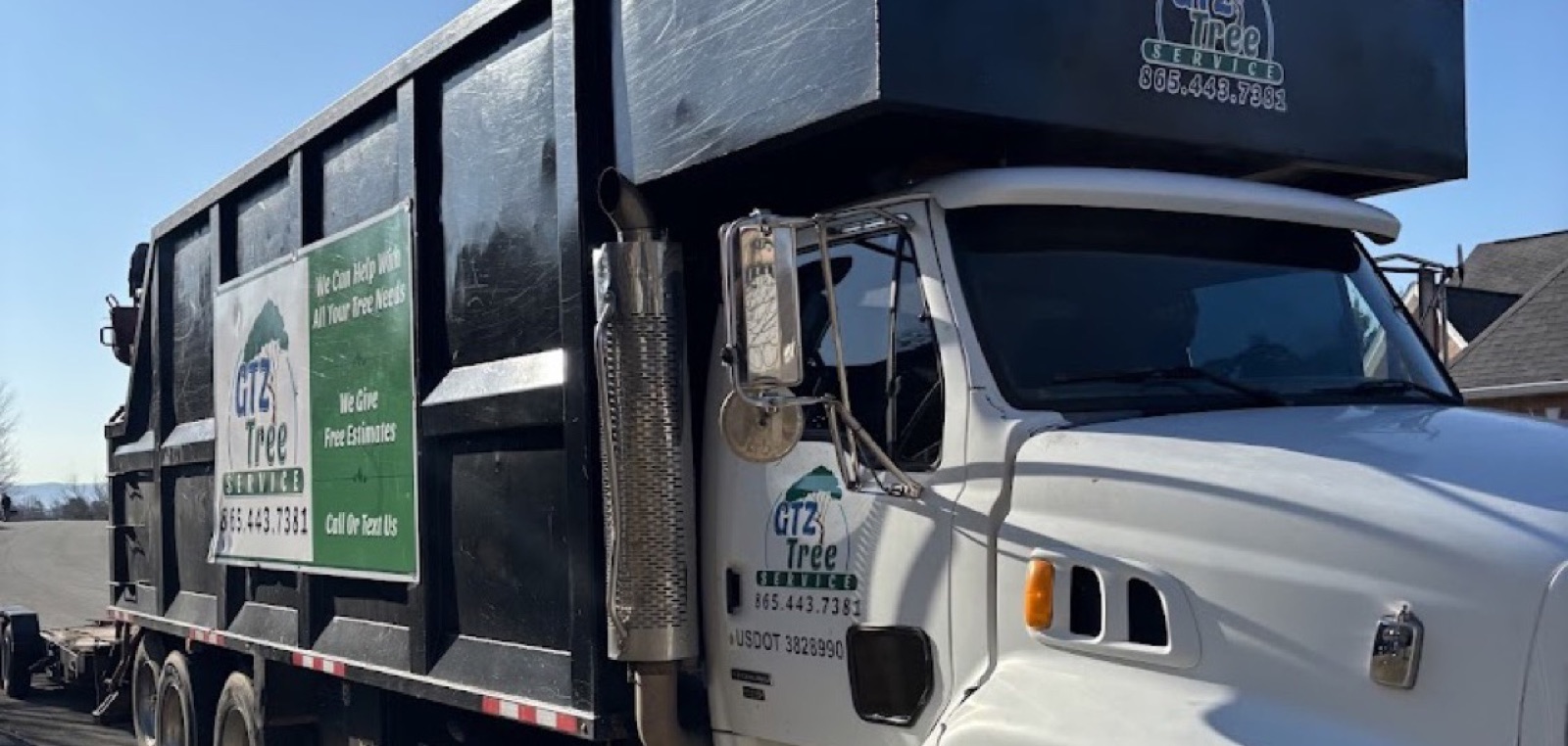 The GTZ Tree Service chip truck parked at a Knoxville job