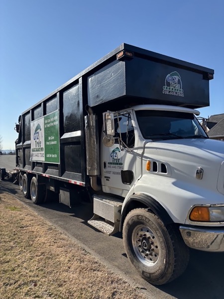 The branded GTZ Tree Service dump truck on a Knoxville job